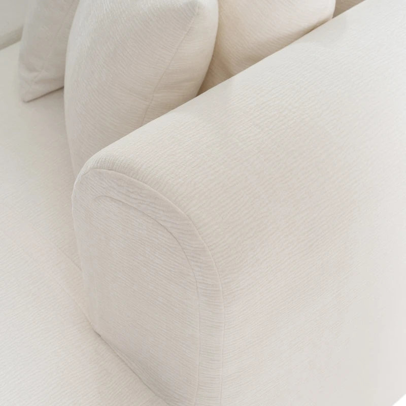 Canapé d'angle quatre places en polyester au design incurvé et surpiqûres larges.