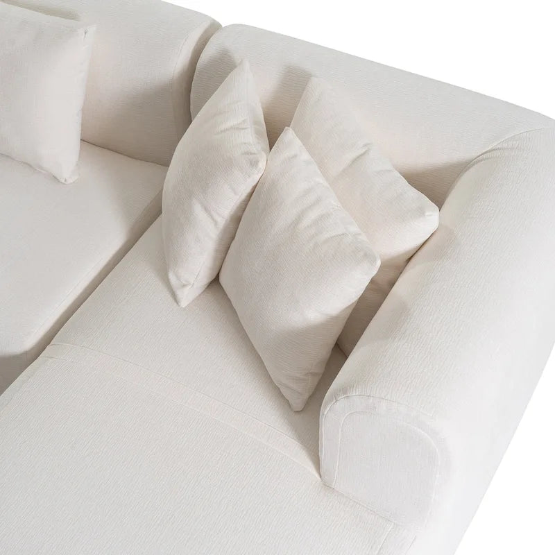 Canapé d'angle quatre places en polyester au design incurvé et surpiqûres larges.