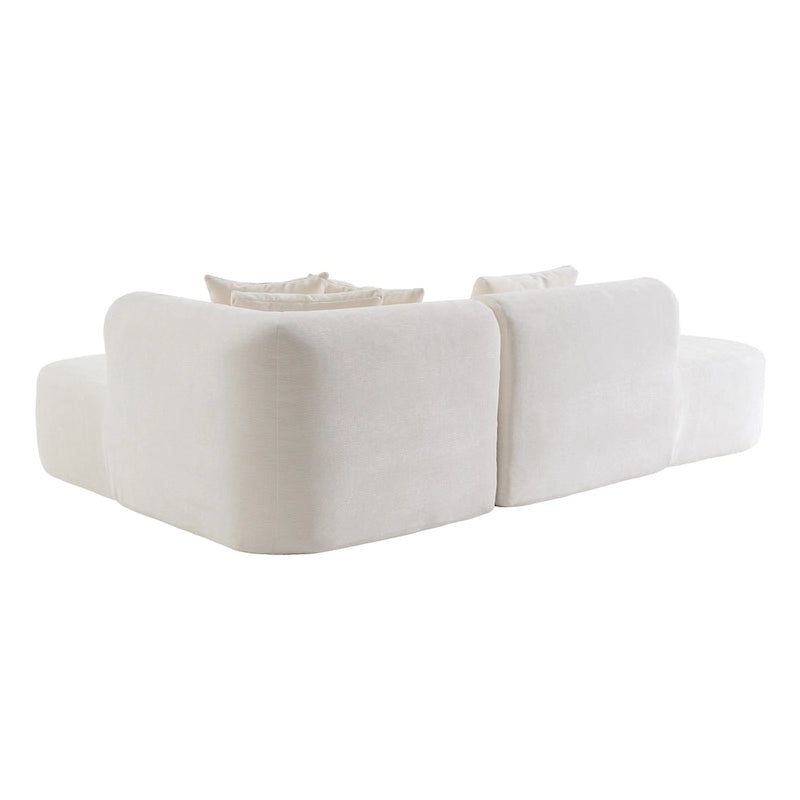 Canapé d'angle quatre places en polyester au design incurvé et surpiqûres larges.
