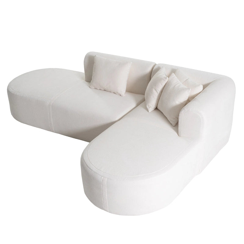 Canapé d'angle quatre places en polyester au design incurvé et surpiqûres larges.