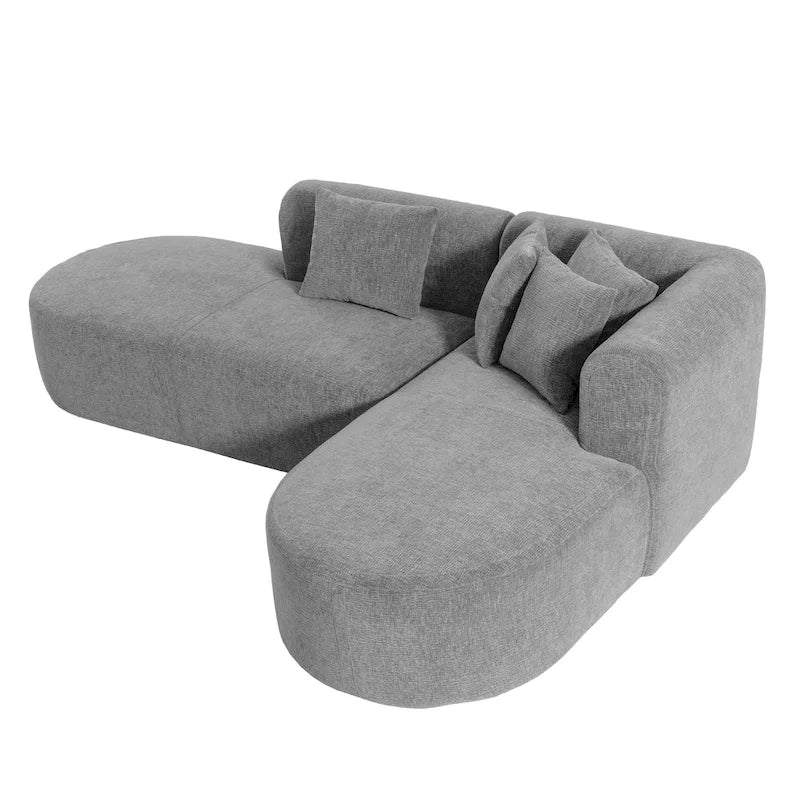 Canapé d'angle quatre places en polyester au design incurvé et surpiqûres larges.