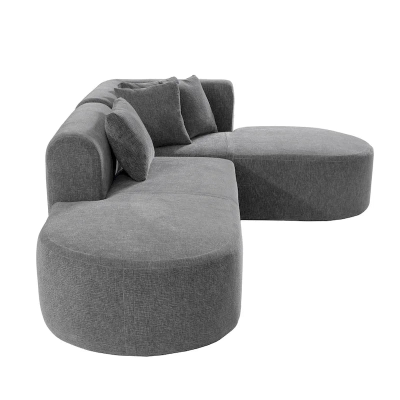 Canapé d'angle quatre places en polyester au design incurvé et surpiqûres larges.