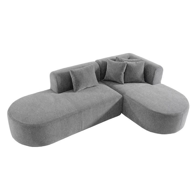 Canapé d'angle quatre places en polyester au design incurvé et surpiqûres larges.