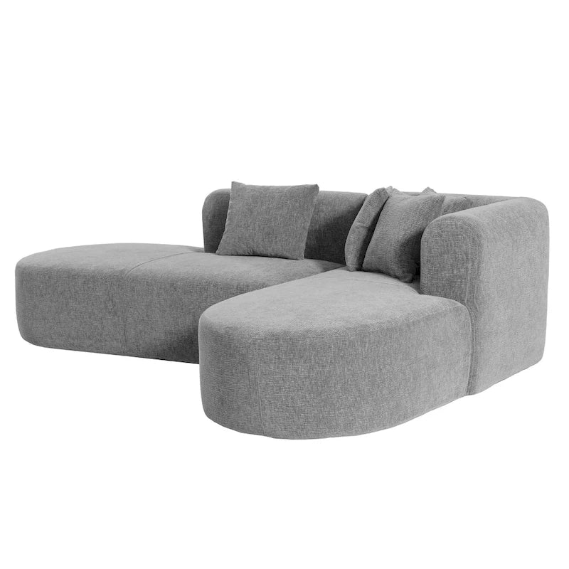 Canapé d'angle quatre places en polyester au design incurvé et surpiqûres larges.